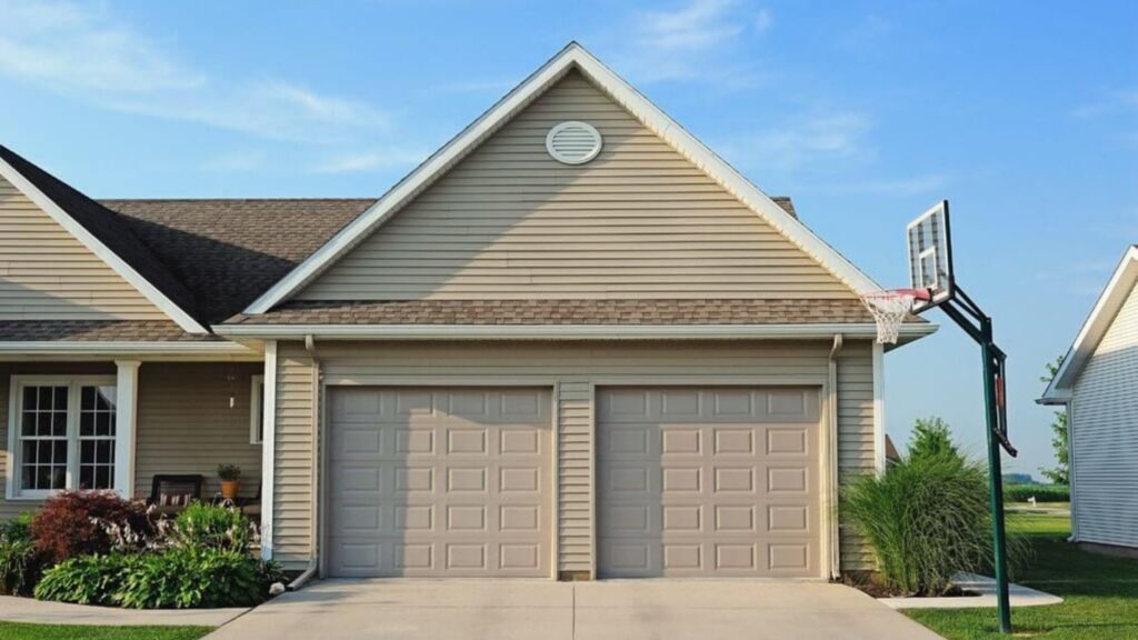 A Classic Style House With Two Garage Doors in a Suburban Neighborhood.