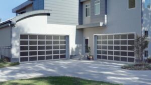 A Modern Style Home With Two Stylish Garage Doors in Black and Steel.