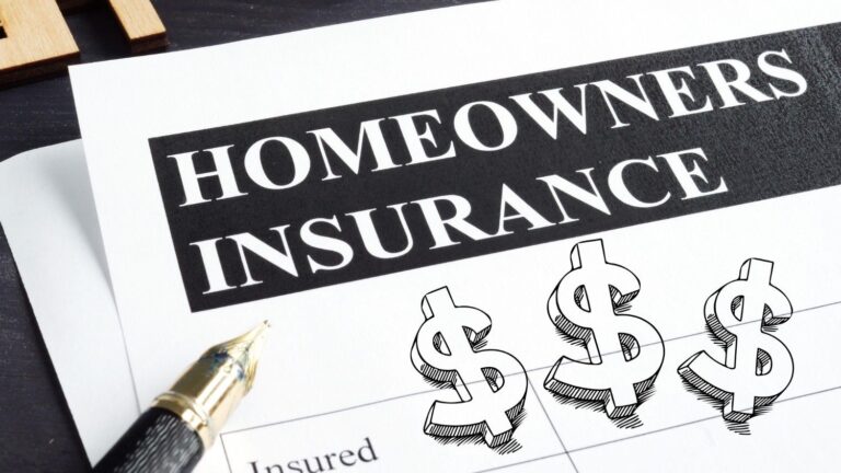 A paper that says homeowners insurance next to a pen and graphic dollar signs.